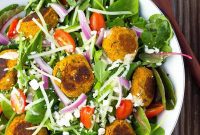 Golden Carrot Falafel Salad Drizzled with Zesty Citrus Tahini