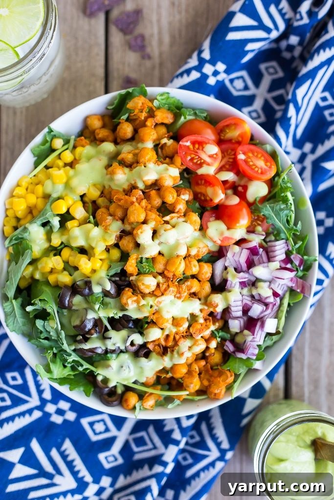 Four Simple Homemade Salad Dressings 3 Creamy Avocado Ranch Dressing in a glass jar, garnished with fresh herbs