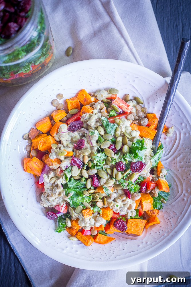 Sweet Potato, Lentil, Kale Prep Bowls with Curry Tahini 4 All the fresh ingredients for Sweet Potato, Lentil, and Kale Meal Prep Salads laid out on a kitchen counter, including raw sweet potatoes, brown lentils, kale, red pepper, red onion, and tahini dressing components.