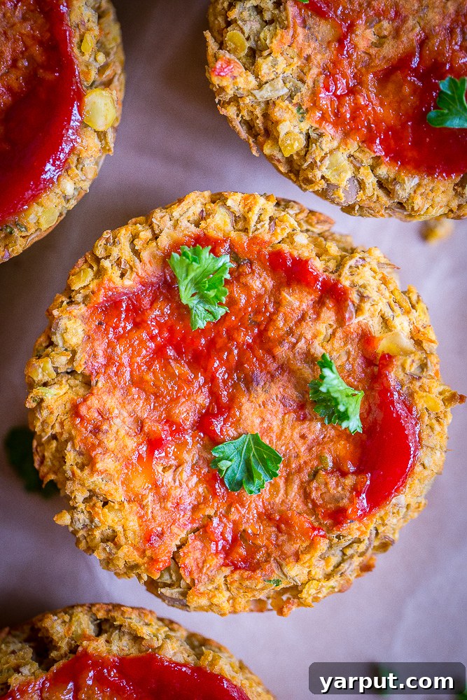 Savory Plant-Powered Lentil Loaf Muffins 2 Beautifully baked Vegan Lentil Meatloaf Cups with a shiny ketchup glaze, presented as a savory holiday main dish.