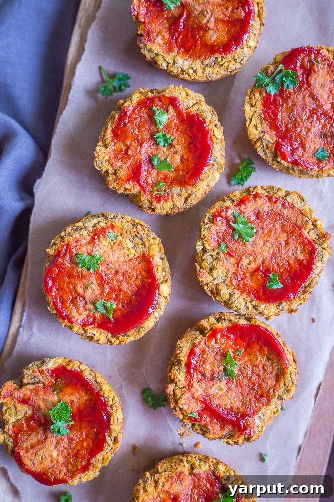 Savory Plant-Powered Lentil Loaf Muffins 5 A festive holiday plate featuring a Vegan Lentil Meatloaf Cup, roasted Brussels sprouts, and creamy mashed potatoes.