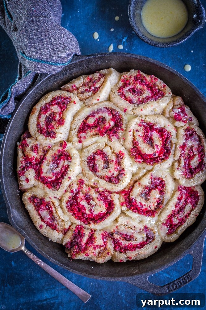 Zesty Gluten-Free Orange Cranberry Cinnamon Swirls 2 Bright and festive Gluten-Free Orange Cranberry Cinnamon Rolls, perfect for a vegan breakfast treat.