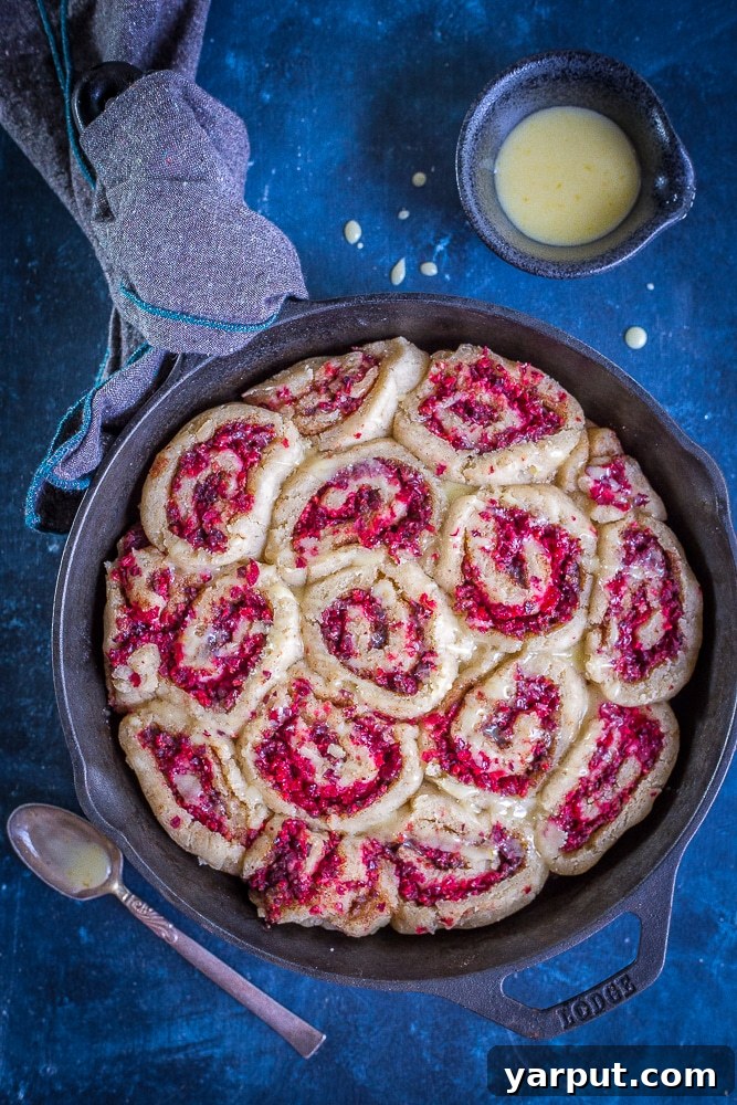 Zesty Gluten-Free Orange Cranberry Cinnamon Swirls 4 A tray of Gluten-Free Orange Cranberry Cinnamon Rolls ready for the oven, showcasing their perfect spirals.