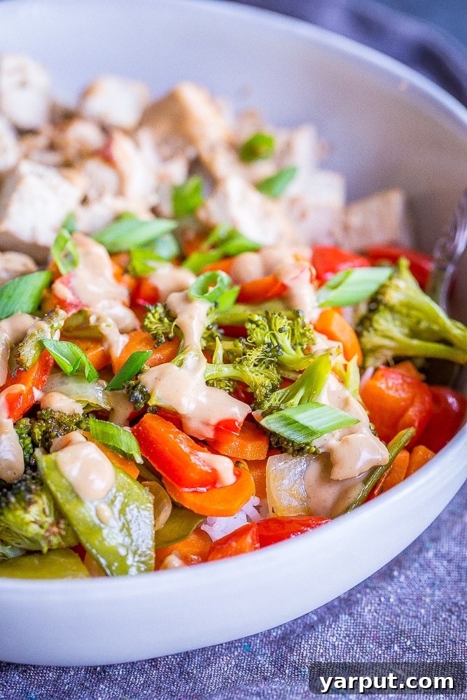 One-Pan Ginger Peanut Tofu Power Bowls 6 Close-up of a beautifully assembled Sheet Pan Tofu and Vegetable Bowl, ready to be enjoyed.