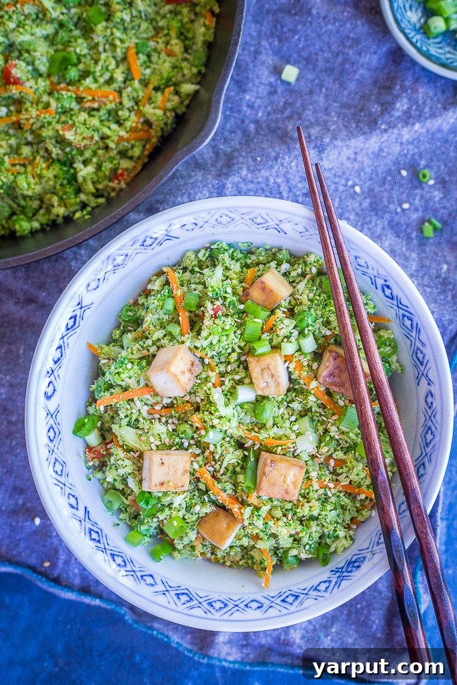 Easy Riced Broccoli Stir-Fry 2 Vibrant and healthy Easy Broccoli Fried 'Rice' with fresh vegetables, ready to be served. A perfect vegan and gluten-free meal.