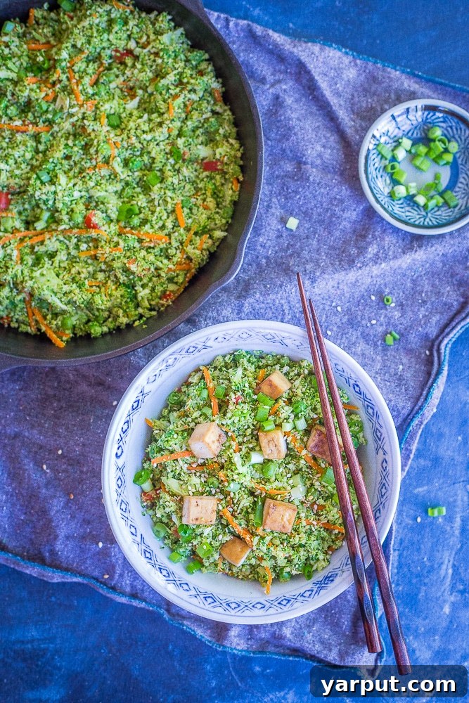 Easy Riced Broccoli Stir-Fry 5 A vibrant bowl of Easy Broccoli Fried 'Rice' with tofu and green onions, showcasing its delicious appeal.