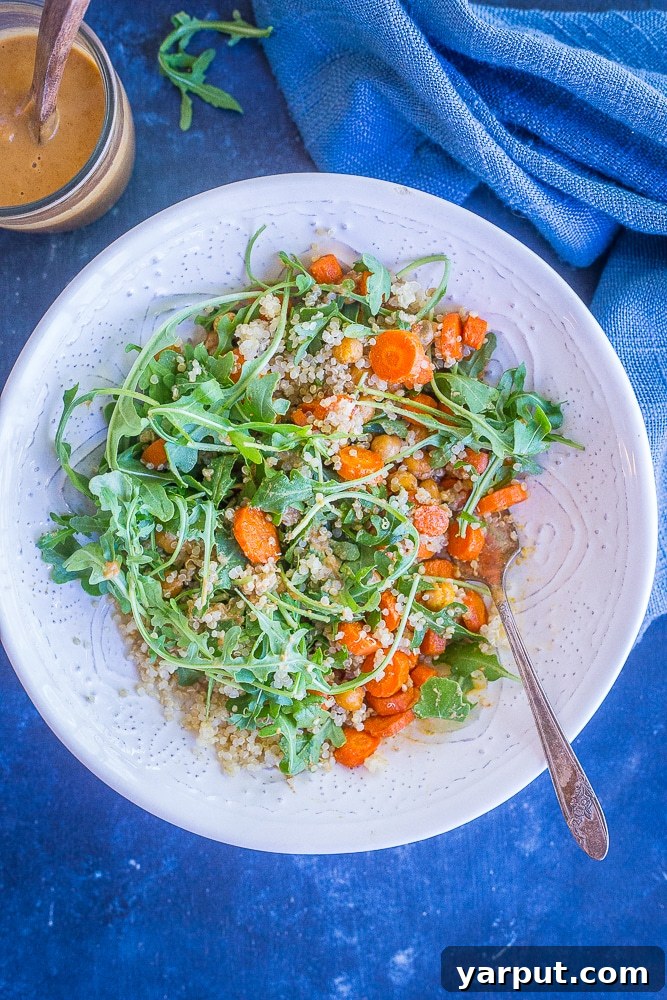 Zesty Cashew Roast Carrot Chickpea Power Bowl 5 Four perfectly portioned Roasted Carrot and Chickpea Salad meal prep bowls, ready for a week of healthy lunches.