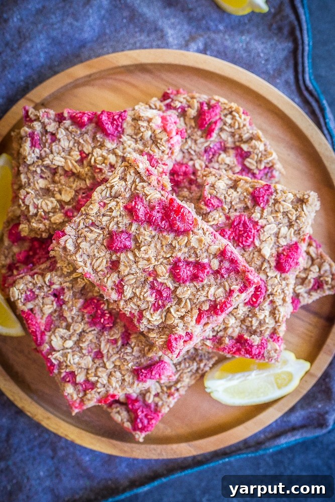 Sun-Kissed Lemon Raspberry Baked Oats 6 A top down view of a plate of lemon raspberry baked oatmeal