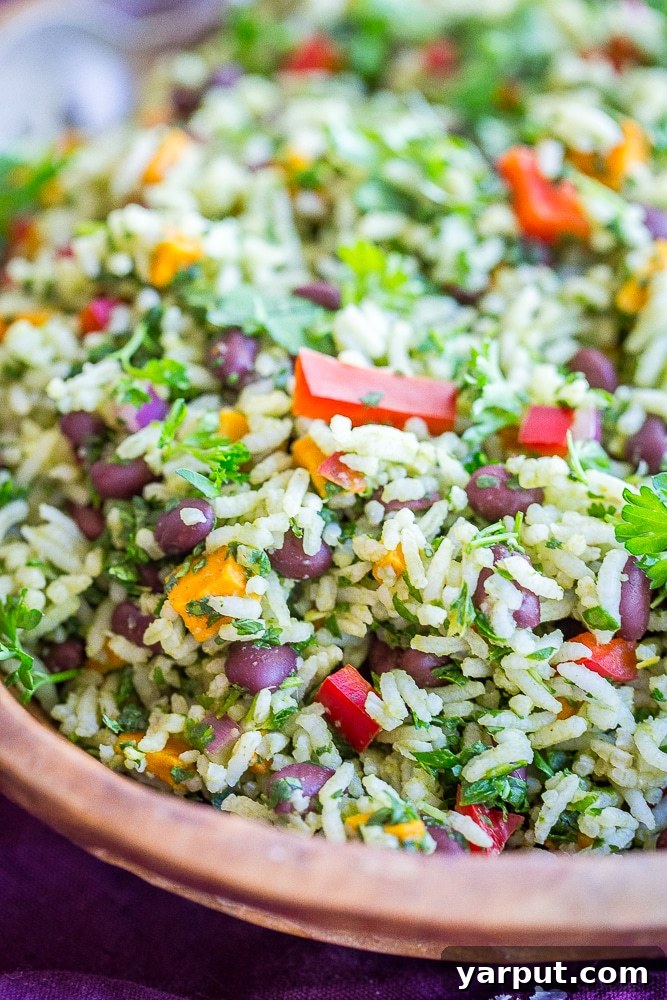 An inviting close-up of the finished Green Rice with Black Beans and Sweet Potato, showcasing its vibrant colors and delicious texture, ready to be served.