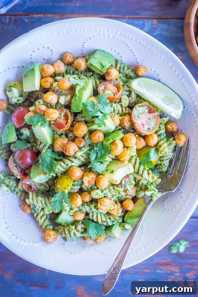 Tex-Mex Pesto Pasta with Crispy Chickpeas 4 A delicious close-up of a bowl of Southwestern Pesto Pasta, showcasing the vibrant colors and appealing textures of the pasta, pesto, and crispy chickpeas.