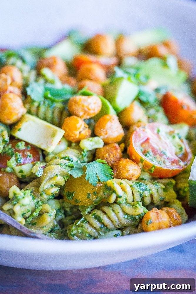 Tex-Mex Pesto Pasta with Crispy Chickpeas 6 A close-up, inviting front view of Southwestern Pesto Pasta, generously topped with crispy chickpeas, showcasing its delicious appeal.