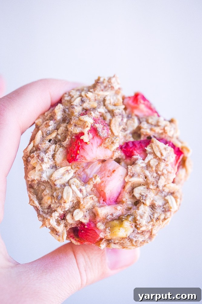 Wholesome Strawberry Banana Baked Oatmeal Cups 5 Several strawberry banana baked oatmeal cups cooling on a wire rack, ready to be enjoyed.