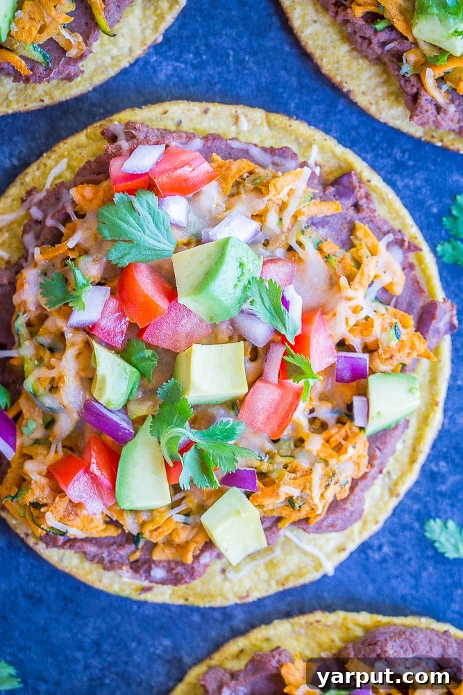 Quick and Colorful Sweet Potato Zucchini Tostadas 5 Top down view of four 30 Minute Sweet Potato and Zucchini Tostadas, garnished and ready to eat
