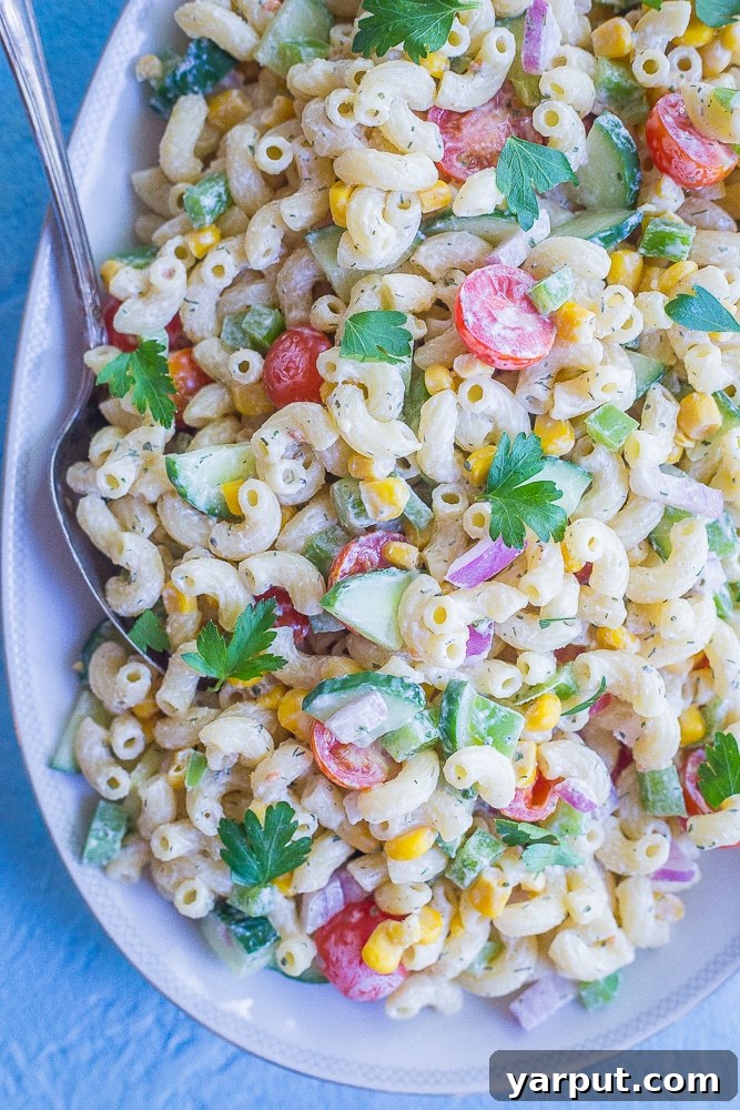 Bright & Light Macaroni Salad Without Mayo 4 Detailed close-up shot of the healthier Greek yogurt macaroni salad, showing the texture of the pasta, vegetables, and creamy dressing.