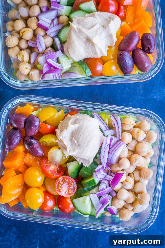Grab-and-Go Greek Salad Prep Bowls 7 Two containers of Easy Greek Salad Meal Prep Bowls, neatly stacked and ready for grab-and-go lunches.