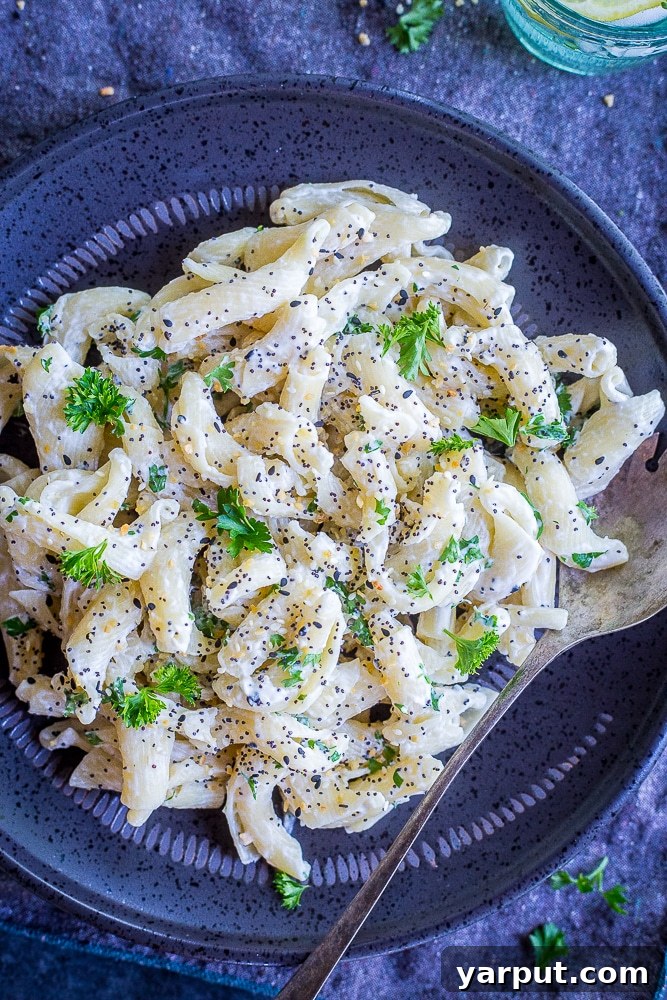 Quick & Delicious: 5-Ingredient Vegetarian Dinners 6 Creamy goat cheese pasta topped with Everything Bagel Spice in a white bowl.