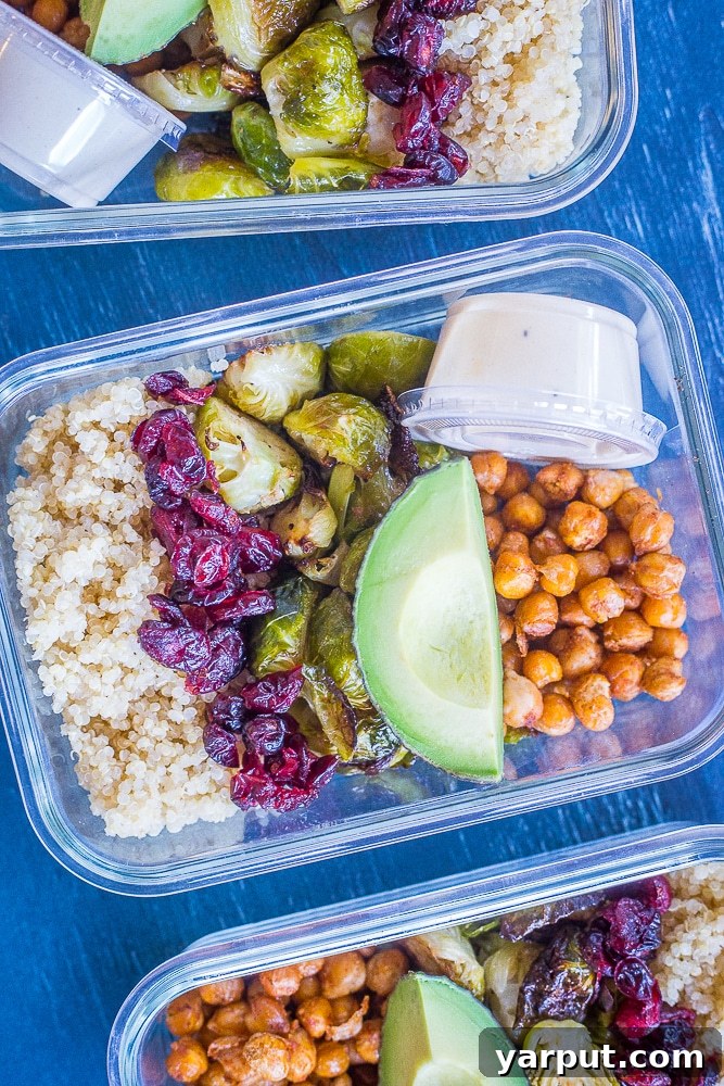 Golden Roasted Brussels & Chickpea Bowls 2 A vibrant close-up of Roasted Brussels Sprout and Chickpea Meal Prep Bowls, highlighting crispy sprouts, golden chickpeas, fluffy quinoa, fresh avocado, and a creamy lemon tahini dressing, ready for a healthy lunch.