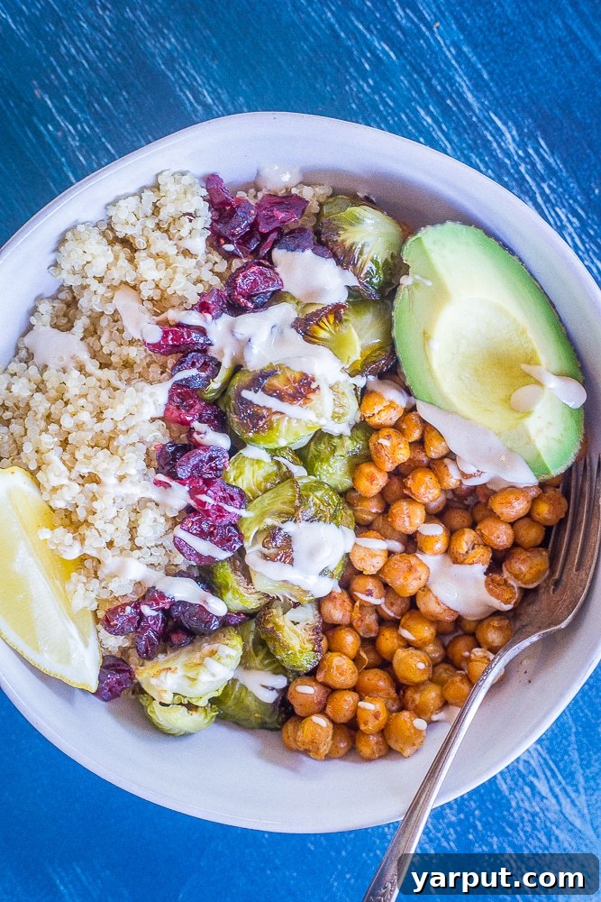 Golden Roasted Brussels & Chickpea Bowls 4 A large, inviting bowl of Roasted Brussels Sprout and Chickpea Meal Prep Bowls, showcasing the vibrant array of ingredients expertly combined.