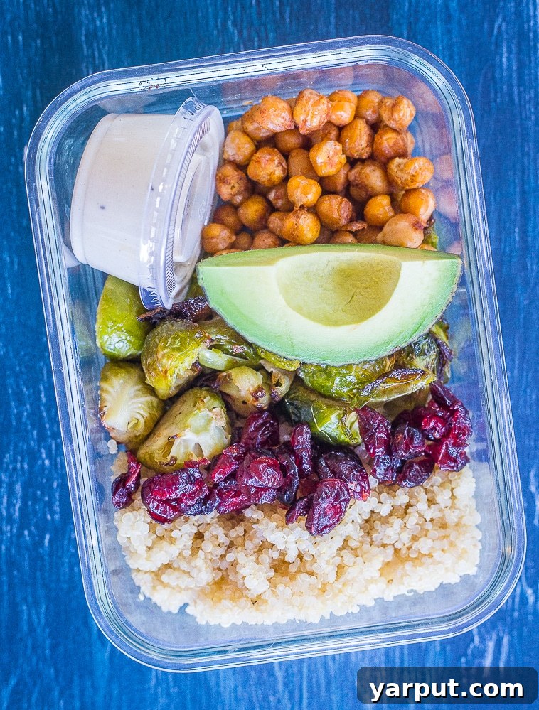 Golden Roasted Brussels & Chickpea Bowls 5 A close-up view of a single Roasted Brussels Sprout and Chickpea Meal Prep Bowl, highlighting the texture and freshness of each ingredient.