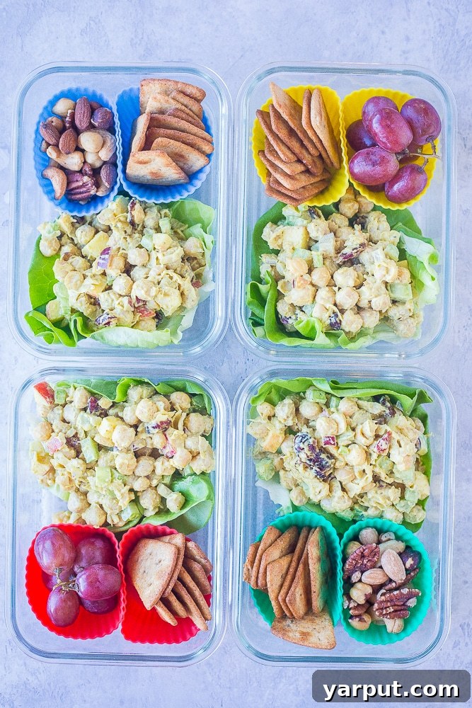 Vibrant Curried Chickpea Lunch Boxes 4 Four Curried Chickpea Salad Meal Prep Bowls neatly arranged side-by-side, ready for the week's lunches