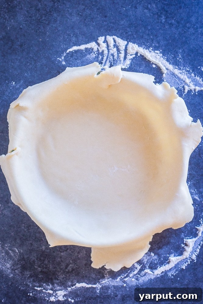 Dough for coconut oil pie crust coming together in a food processor