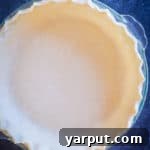 Close-up of baked coconut oil pie crust