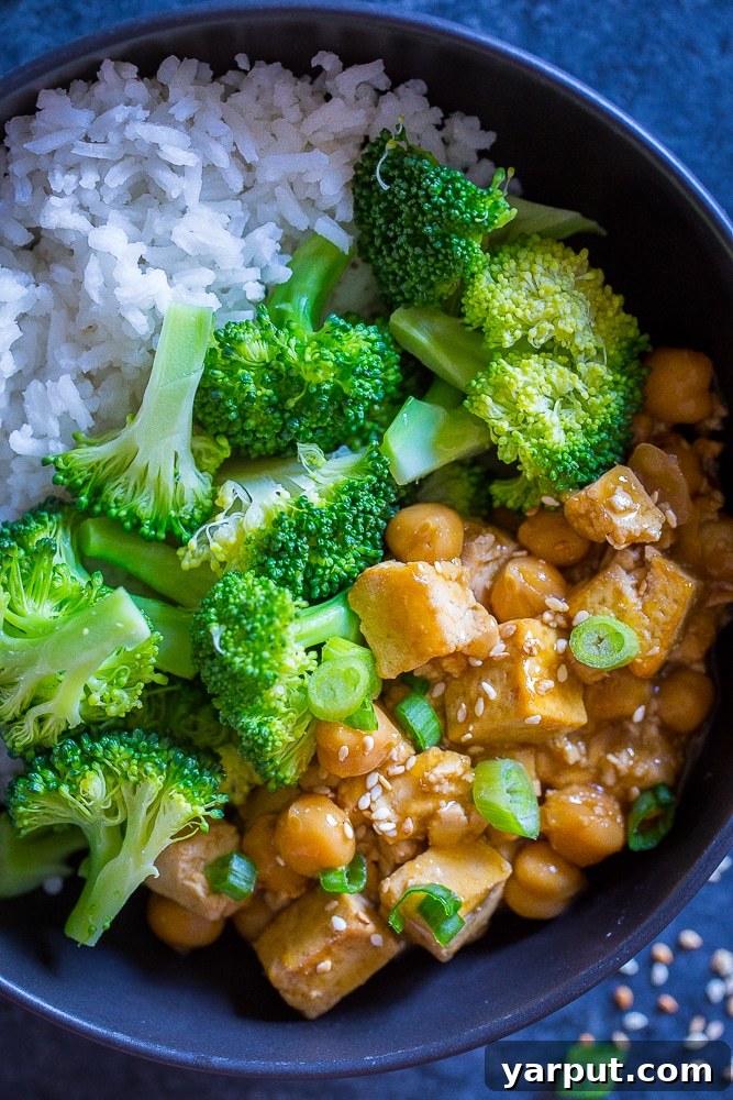 Bright Citrus Tofu & Chickpea Meal Prep Bowls 4 Close up of Orange Tofu Chickpea Bowls, highlighting the sticky orange sauce and fresh ingredients