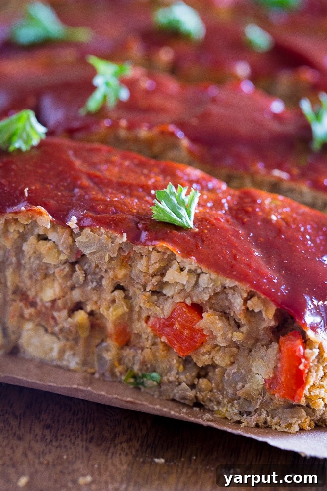 Hearty Lentil and Chickpea Vegan Meatloaf 5 View of inside Easy Vegan Meatloaf with Lentils and Chickpeas, showing the hearty texture and rich color