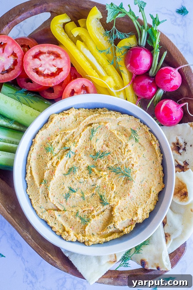 67 Vegan Holiday Recipes: Appetizers, Side Dishes, Salads, Main Courses, and Desserts 3 Roasted Carrot and Dill Hummus served with crackers