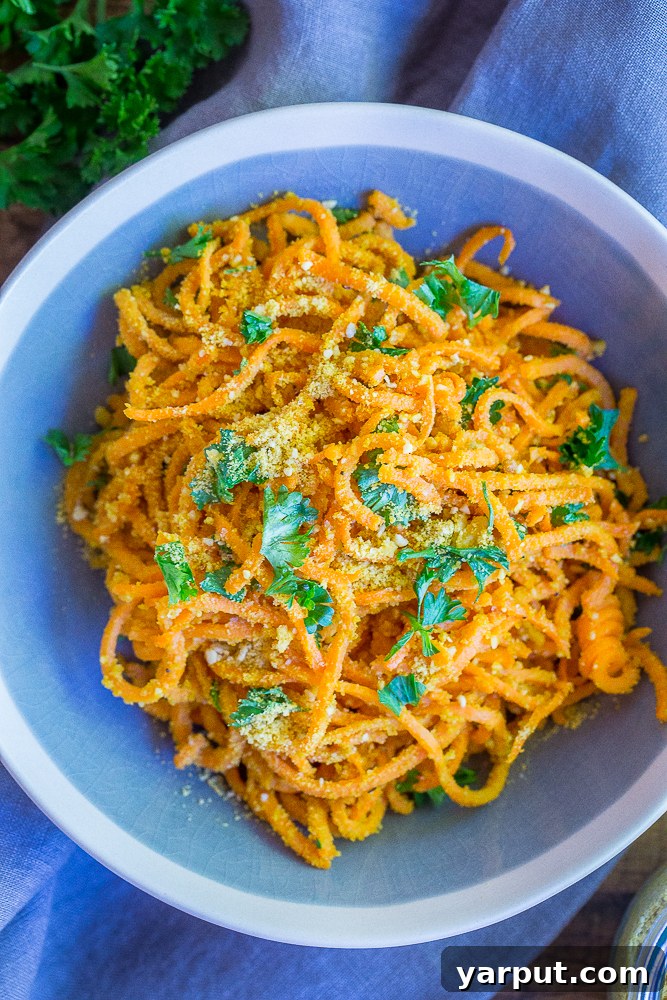 67 Vegan Holiday Recipes: Appetizers, Side Dishes, Salads, Main Courses, and Desserts 27 Garlic Parmesan Sweet Potato Noodles in a skillet