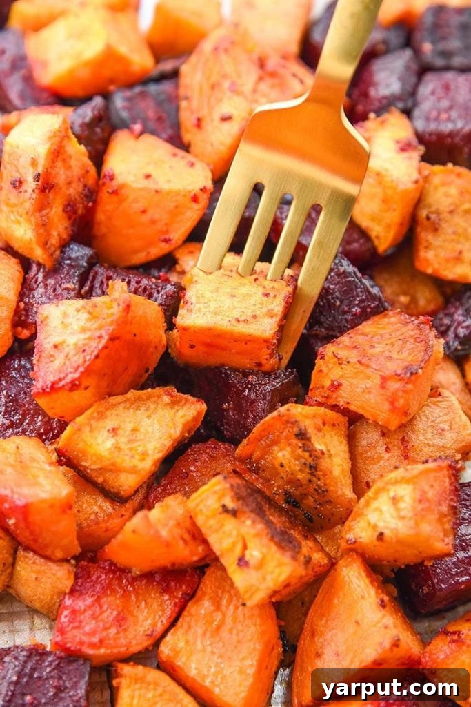 67 Vegan Holiday Recipes: Appetizers, Side Dishes, Salads, Main Courses, and Desserts 32 Roasted Beets and Sweet Potatoes on a baking sheet