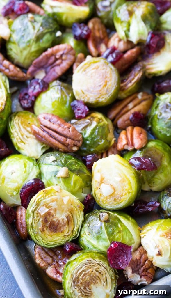 67 Vegan Holiday Recipes: Appetizers, Side Dishes, Salads, Main Courses, and Desserts 33 Maple Balsamic Roasted Brussels Sprouts in a serving bowl