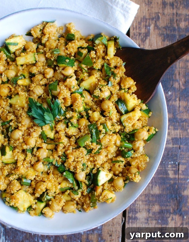 67 Vegan Holiday Recipes: Appetizers, Side Dishes, Salads, Main Courses, and Desserts 36 Zucchini Chickpea Quinoa Salad in a serving bowl