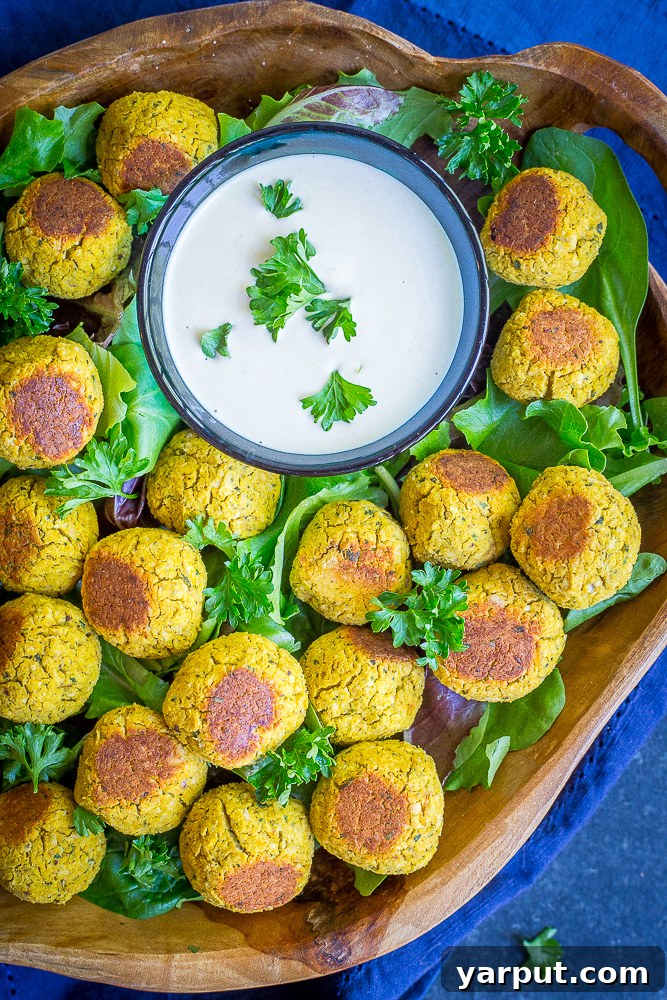 67 Vegan Holiday Recipes: Appetizers, Side Dishes, Salads, Main Courses, and Desserts 5 Roasted Butternut Squash Falafel Bites on a plate