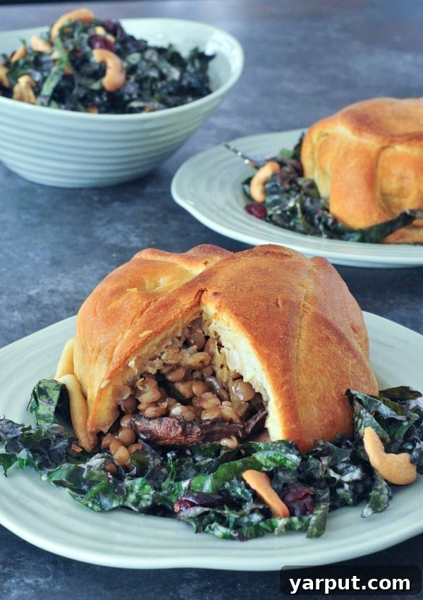 67 Vegan Holiday Recipes: Appetizers, Side Dishes, Salads, Main Courses, and Desserts 56 Healthy Portobello Wellingtons on a plate