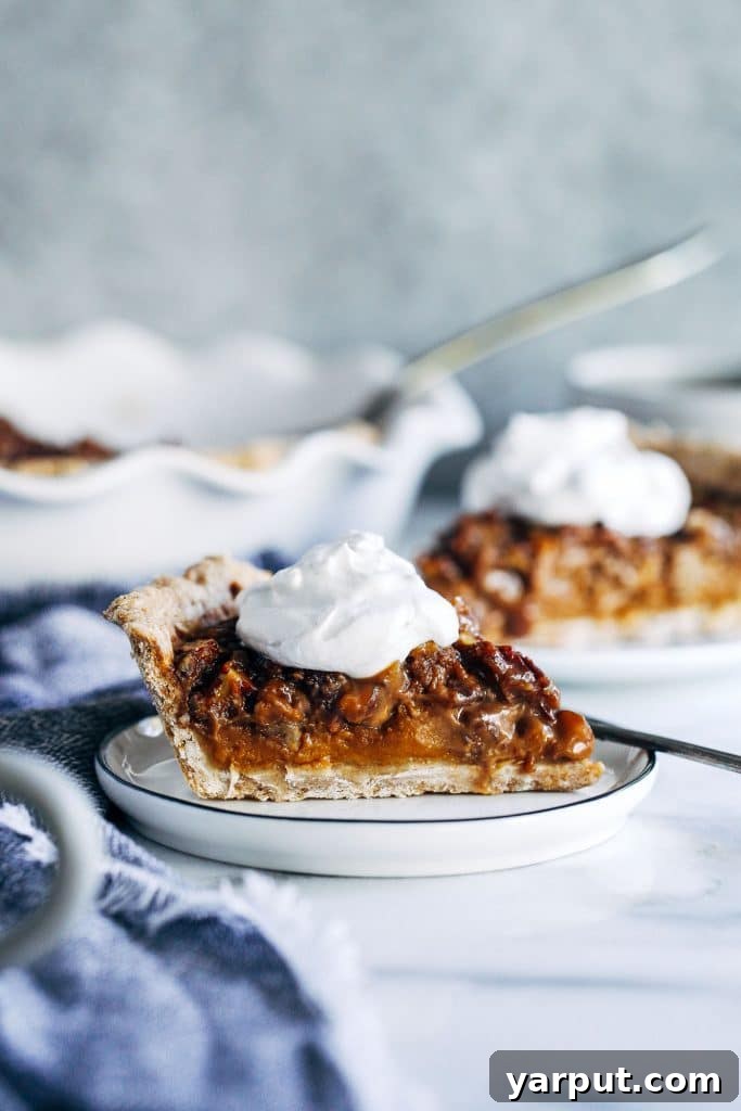 67 Vegan Holiday Recipes: Appetizers, Side Dishes, Salads, Main Courses, and Desserts 58 Vegan Sweet Potato Pecan Pie with a slice removed