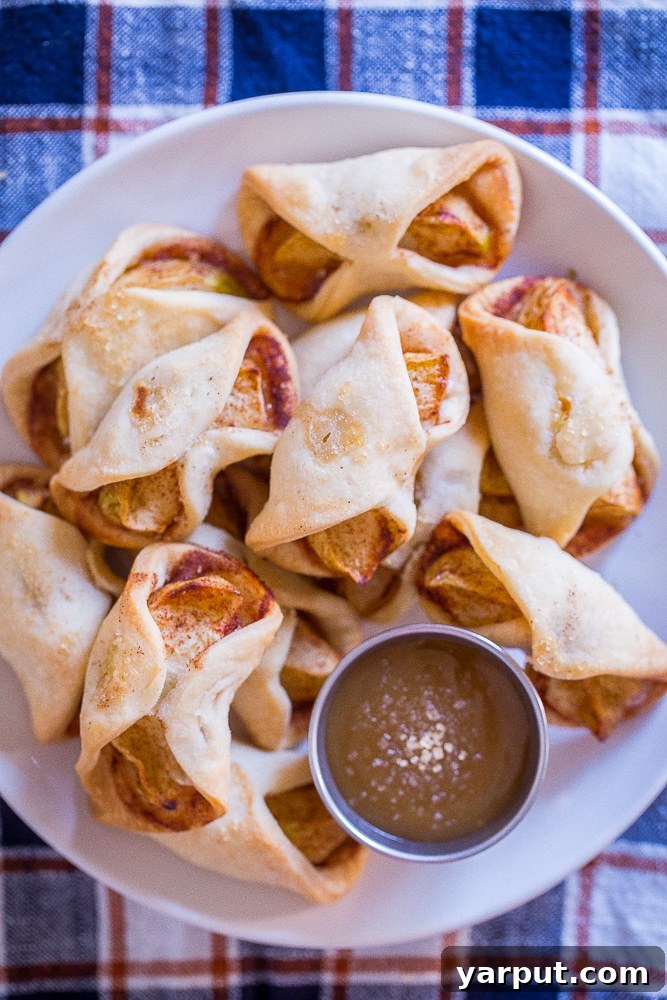 Simple Apple Pie Morsels 2 Delicious Easy Apple Pie Bites served on a plate with a side of rich caramel sauce, perfect for dipping.