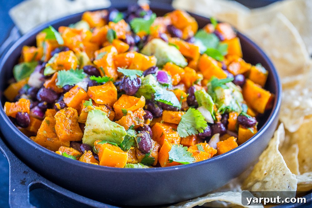 Golden Harvest Butternut & Black Bean Bowl 6 A close-up view of the roasted butternut squash and black bean salad, highlighting its rich textures and inviting colors.