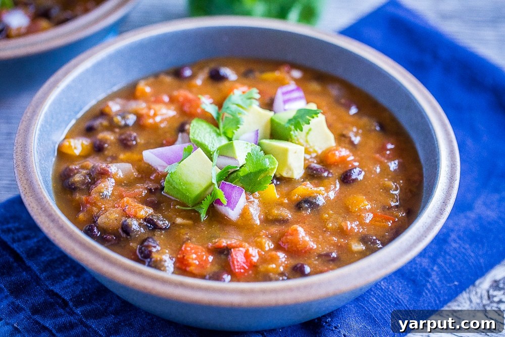 A close-up view of the hearty Butternut Squash Chili, showcasing its rich texture and color.