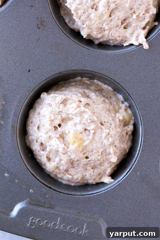 Healthy One Bowl Banana Muffins No Added Sugar 5 Healthy Banana Muffin batter in the muffin tin