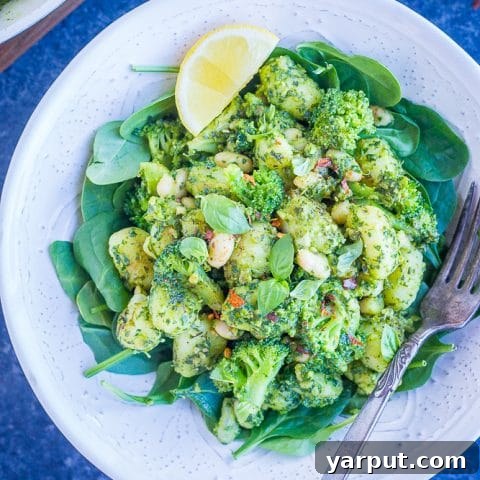 Pesto Gnocchi with White Beans and Broccoli served in a bowl