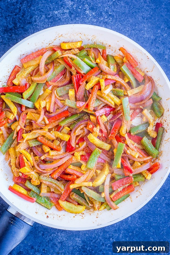 Sizzling 30-Minute Fajita Tostadas 4 Sautéed fajita vegetables, including red and green bell peppers, onions, and yellow squash, sizzling in a hot pan