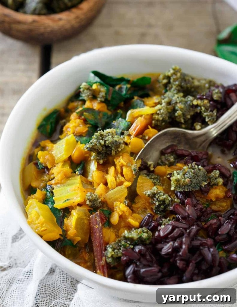 26 Vegan One-Pot Wonders for Easy Weeknights 21 Golden Turmeric Lentil Stew, served in a white bowl with fresh parsley
