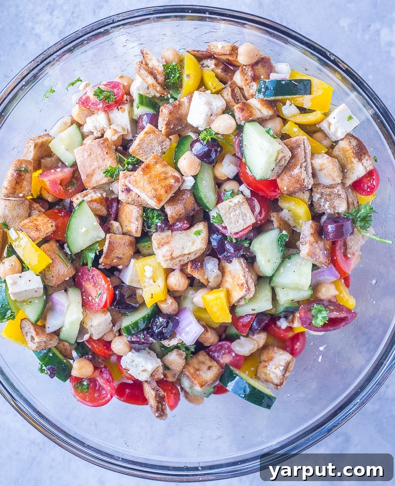 Aegean Chopped Salad with Golden Pita Crisps 5 A large bowl of freshly prepared Greek Chopped Salad with Crispy Pita, ready to be served.