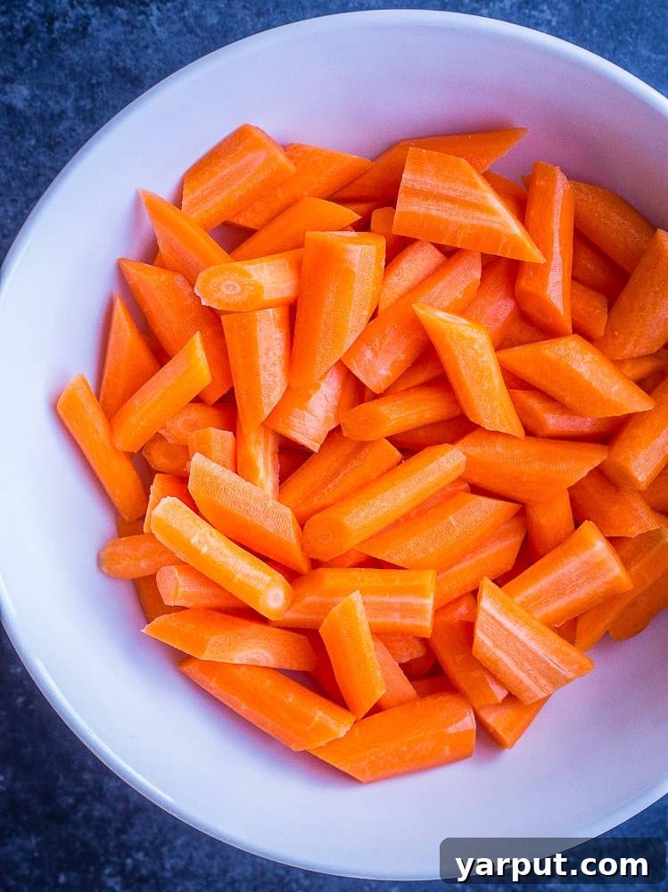 Delicious Ranch-Roasted Carrots 4 A bowl of freshly cut carrots, prepped for the Ranch Roasted Carrot Recipe