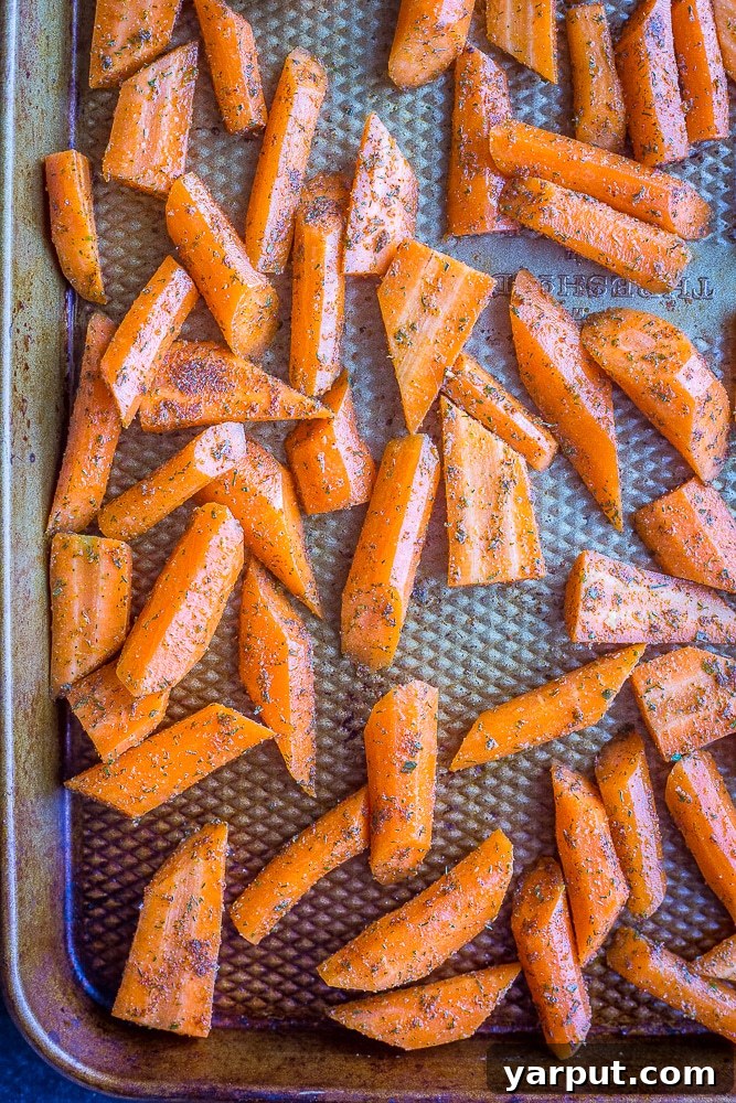 Delicious Ranch-Roasted Carrots 5 Ranch Roasted Carrots on a sheet pan, seasoned and ready for the oven