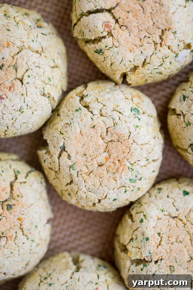 Foolproof Homemade Falafel 5 Sheet pan filled with perfectly formed Easy Homemade Baked Falafel Balls, golden brown and ready to serve.