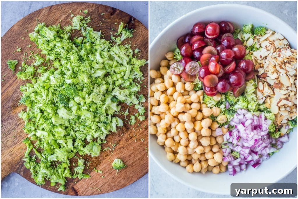 Vibrant Broccoli Salad with Golden Tahini Dressing 3 Close-up of freshly chopped broccoli and other salad ingredients, including chickpeas and red onion, on a cutting board, ready for mixing.
