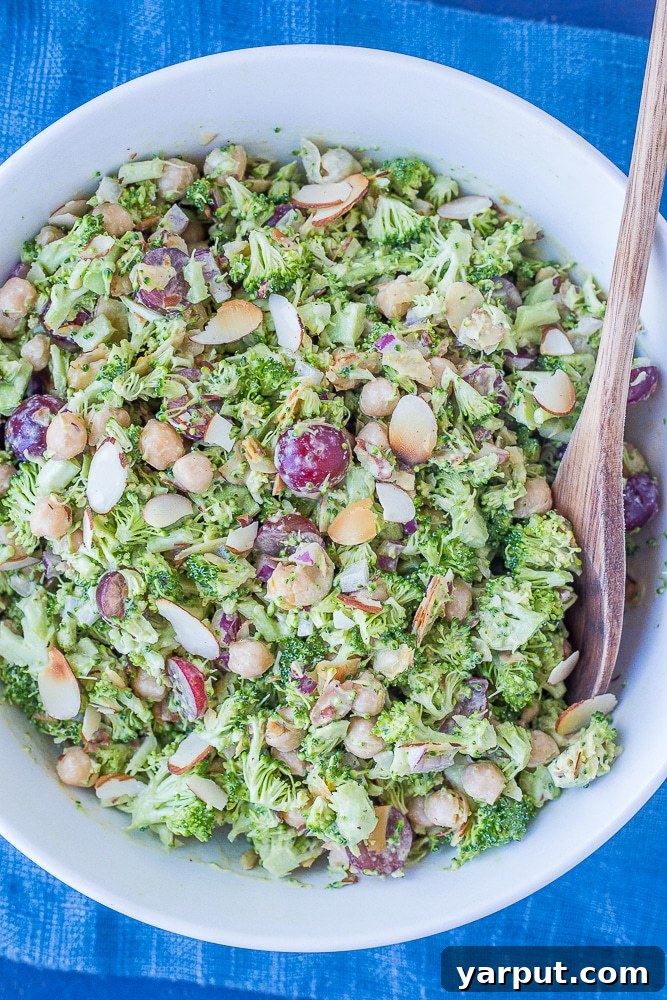 Vibrant Broccoli Salad with Golden Tahini Dressing 5 A large, vibrant bowl of Creamy Broccoli Salad, perfectly mixed and ready to be served at a gathering.