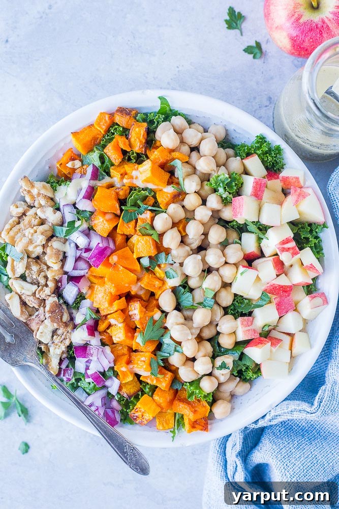 Autumn Abundance Salad 2 Fall Harvest Salad Recipe in a bowl, showcasing kale, roasted butternut squash, crisp apples, walnuts, chickpeas and red onion.